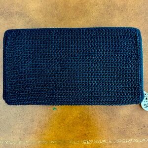 Sak zip around wallet. Black Like new. non smoking home